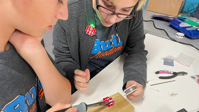 Students soldering 