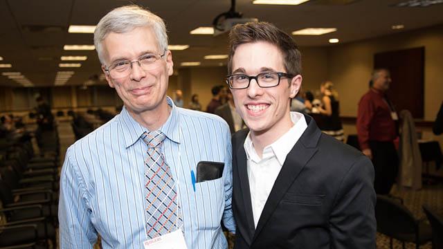 father and son smiling 